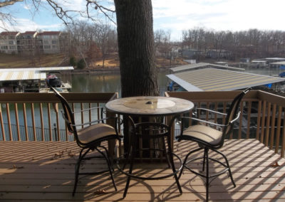 view of deck with lake in background